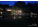A home with a private dock that features string lights for nighttime enjoyment at 24756 Strand Dr, Albemarle, NC 28001