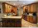 Spacious kitchen with granite countertops, stainless steel appliances, and wood cabinetry at 24756 Strand Dr, Albemarle, NC 28001