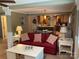 Comfortable living room with a sofa and seamless transition into the open kitchen at 24756 Strand Dr, Albemarle, NC 28001