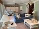 Cozy living room with comfortable seating, nautical decor, and soft, inviting natural light at 24756 Strand Dr, Albemarle, NC 28001