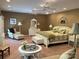 Large main bedroom featuring ample sitting area, plantation shutters and dual ceiling fans at 24756 Strand Dr, Albemarle, NC 28001