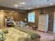 Expansive main bedroom with sitting area, plantation shutters and a writing desk at 24756 Strand Dr, Albemarle, NC 28001