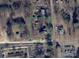 An aerial view of the property with a clearly defined boundary, surrounded by roads and local neighborhood amenities at 305 Huntersville Concord Rd, Huntersville, NC 28078