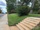 Home's front yard featuring a grassy lawn, steps leading up to the property, and street access at 305 Huntersville Concord Rd, Huntersville, NC 28078