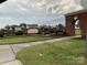 Subdivision brick sign for Holly Park surrounded by green grass and manicured bushes at 4016 Holly Villa Cir, Indian Trail, NC 28079