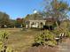 Community gazebo with a picnic table and bench seating in a grassy park setting at 4016 Holly Villa Cir, Indian Trail, NC 28079