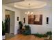 Elegant dining room with tray ceilings, chandelier and plenty of room for hosting gatherings at 4016 Holly Villa Cir, Indian Trail, NC 28079