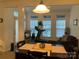 Dining room area with large windows and a treadmill and a lot of light at 4016 Holly Villa Cir, Indian Trail, NC 28079