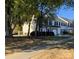 View of attractive townhomes featuring brick and vinyl siding, garages, and manicured landscaping at 4016 Holly Villa Cir, Indian Trail, NC 28079