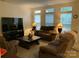 Cozy living room with large windows, offering lots of natural light at 4016 Holly Villa Cir, Indian Trail, NC 28079