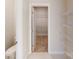 Hallway bathroom area with a toilet, wire shelving and walk-in closet at 515 Tates Trl # 39, Cramerton, NC 28032