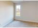 Cozy bedroom with neutral carpet, a single window, and ample wall space at 515 Tates Trl # 39, Cramerton, NC 28032