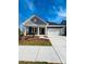 Charming single-Gathering home with well-manicured lawn, gray siding and a two-car garage at 515 Tates Trl # 39, Cramerton, NC 28032