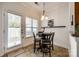 Cozy breakfast nook with a round table and chairs near sliding glass door at 5635 Tipperlinn Way, Charlotte, NC 28278