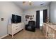 bedroom with two cribs, basketball decor, chair, and neutral colors to create a relaxing space at 1041 Kensrowe Ln, Matthews, NC 28104