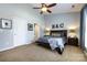 Cozy bedroom with vaulted ceilings and a ceiling fan, creating a comfortable and relaxing space at 1041 Kensrowe Ln, Matthews, NC 28104