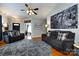 Cozy living room with two sofas, area rug, hardwood floors and views of the front door at 1041 Kensrowe Ln, Matthews, NC 28104