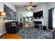 Bright living room with hardwood floors, fireplace, and an open view into the kitchen and dining area at 1041 Kensrowe Ln, Matthews, NC 28104