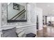 Elegant hallway featuring decorative wallpaper, a mirror, and views of the staircase and living room at 1290 Kindness Nw Ct, Concord, NC 28027