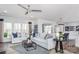 Spacious living room with natural light, stylish decor, a ceiling fan, and comfortable seating arrangement at 1290 Kindness Nw Ct, Concord, NC 28027