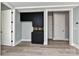 Modern basement wet bar with dark cabinetry and light flooring at 569 Evergreen Rd, Clover, SC 29710