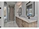 Modern bathroom with double vanity, marble countertop, and glass shower at 569 Evergreen Rd, Clover, SC 29710