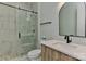 Modern bathroom with a frameless shower and pebble floor at 569 Evergreen Rd, Clover, SC 29710