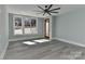 Light and airy bedroom with wood-look floors and access to patio at 569 Evergreen Rd, Clover, SC 29710