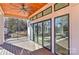 Covered deck with wood ceiling, ceiling fan, and lake views at 569 Evergreen Rd, Clover, SC 29710