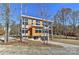 Contemporary home with wood siding and a large window at 569 Evergreen Rd, Clover, SC 29710