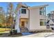 Modern two-story home with wood-toned front door and stone steps at 569 Evergreen Rd, Clover, SC 29710