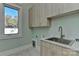 Laundry room with built-in cabinets and a large sink at 569 Evergreen Rd, Clover, SC 29710