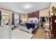 Bright bedroom with large bed, a mirror, and natural light from the window at 7686 Hickory Creek Dr, Denver, NC 28037