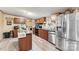 Kitchen showcasing stainless steel appliances, wood cabinets, and a kitchen island at 7686 Hickory Creek Dr, Denver, NC 28037