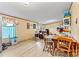 Open living area featuring hardwood floors, a drum kit, and bright natural light at 7686 Hickory Creek Dr, Denver, NC 28037