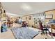 Large living area provides space for diverse activities; drum kit, gaming chair, and a study space at 7686 Hickory Creek Dr, Denver, NC 28037