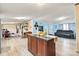 Open living area with hardwood floors connecting to kitchen and featuring modern furniture at 7686 Hickory Creek Dr, Denver, NC 28037