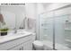 Clean, well-lit bathroom features a glass-enclosed shower, white vanity, and modern fixtures at 107 Rustling Waters Dr, Mooresville, NC 28117