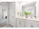 Clean, bright bathroom features double sinks, modern fixtures, and ample counter space at 107 Rustling Waters Dr, Mooresville, NC 28117