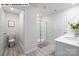 Bright bathroom with a glass enclosed shower, clean white finishes, and modern lighting at 107 Rustling Waters Dr, Mooresville, NC 28117