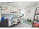 Charming bedroom with bunk beds, desk, large window, stylish decor, and carpeted floors at 107 Rustling Waters Dr, Mooresville, NC 28117