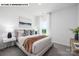 Bright bedroom with a large window and neutral decor, creating a serene and inviting space at 107 Rustling Waters Dr, Mooresville, NC 28117