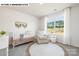 Well-lit Bedroom with crib, comfortable chair, rug, and large window with natural light at 107 Rustling Waters Dr, Mooresville, NC 28117