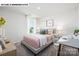 Bright bedroom with large window, bed, desk and chair set on soft carpeting at 107 Rustling Waters Dr, Mooresville, NC 28117