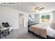 Relaxing bedroom with a large window, soft carpet, and stylish furniture, perfect for unwinding at 107 Rustling Waters Dr, Mooresville, NC 28117