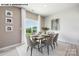 Elegant dining room with a wooden table, six chairs, and a sliding glass door to backyard at 107 Rustling Waters Dr, Mooresville, NC 28117