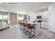 Open-concept kitchen with white cabinets, an island with seating, and modern appliances at 107 Rustling Waters Dr, Mooresville, NC 28117