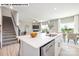 Open-concept kitchen and dining area featuring an island and modern finishes at 107 Rustling Waters Dr, Mooresville, NC 28117
