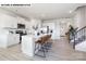 Modern kitchen featuring an island with seating, white cabinets, and stainless steel appliances at 107 Rustling Waters Dr, Mooresville, NC 28117