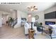 Bright living room with modern decor, wood-look floors, and an electric fireplace under a wall-mounted TV at 107 Rustling Waters Dr, Mooresville, NC 28117